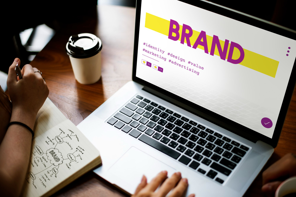 person-desk-brand-strategy-laptop-notepad-brand-development-logo-design